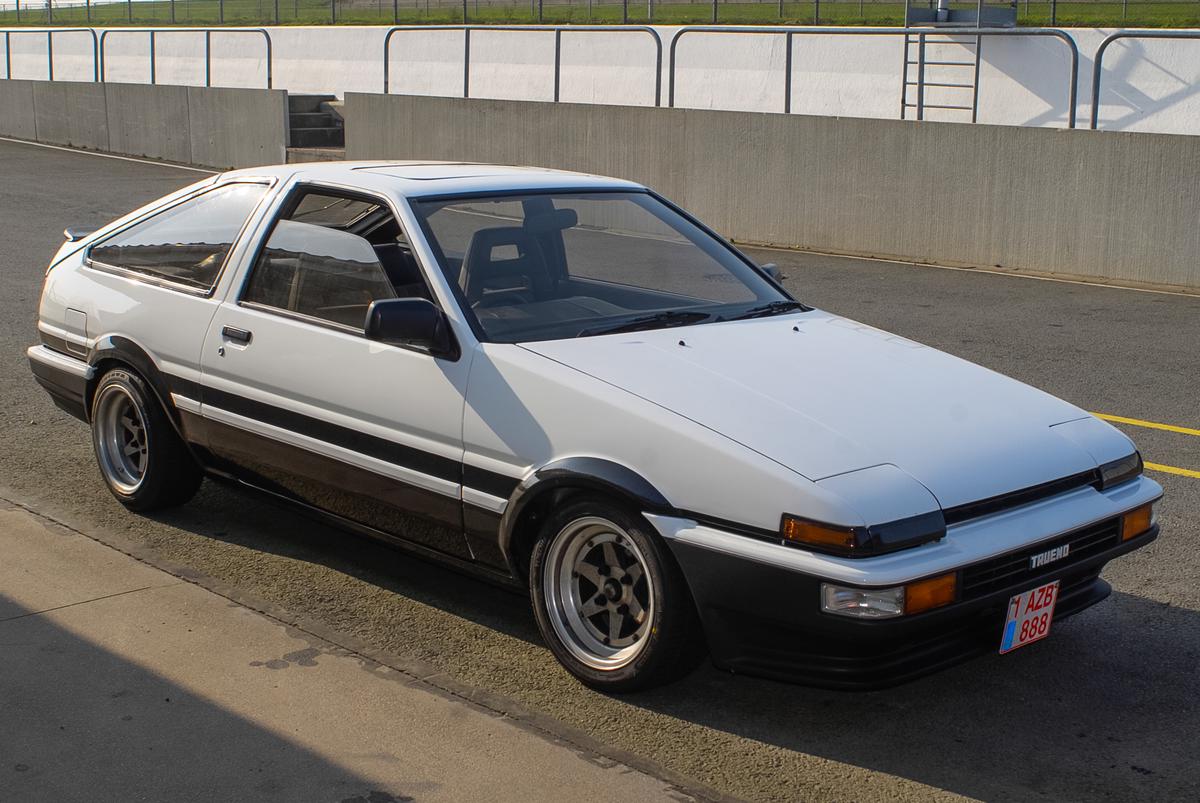 A lineup showcasing the evolution of the Toyota AE86 from 1983 to 1987, displaying different model variations