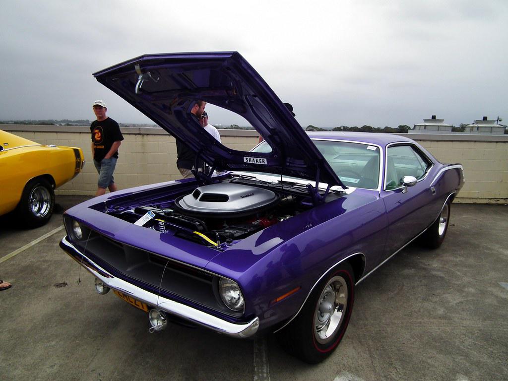 A 1970 Plymouth HEMI 'Cuda showcasing its sleek design features including the long hood, short deck, and raked windshield