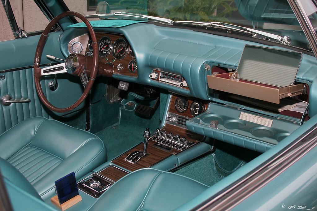 The elegant interior of a Studebaker Hawk, focusing on the dashboard and steering wheel