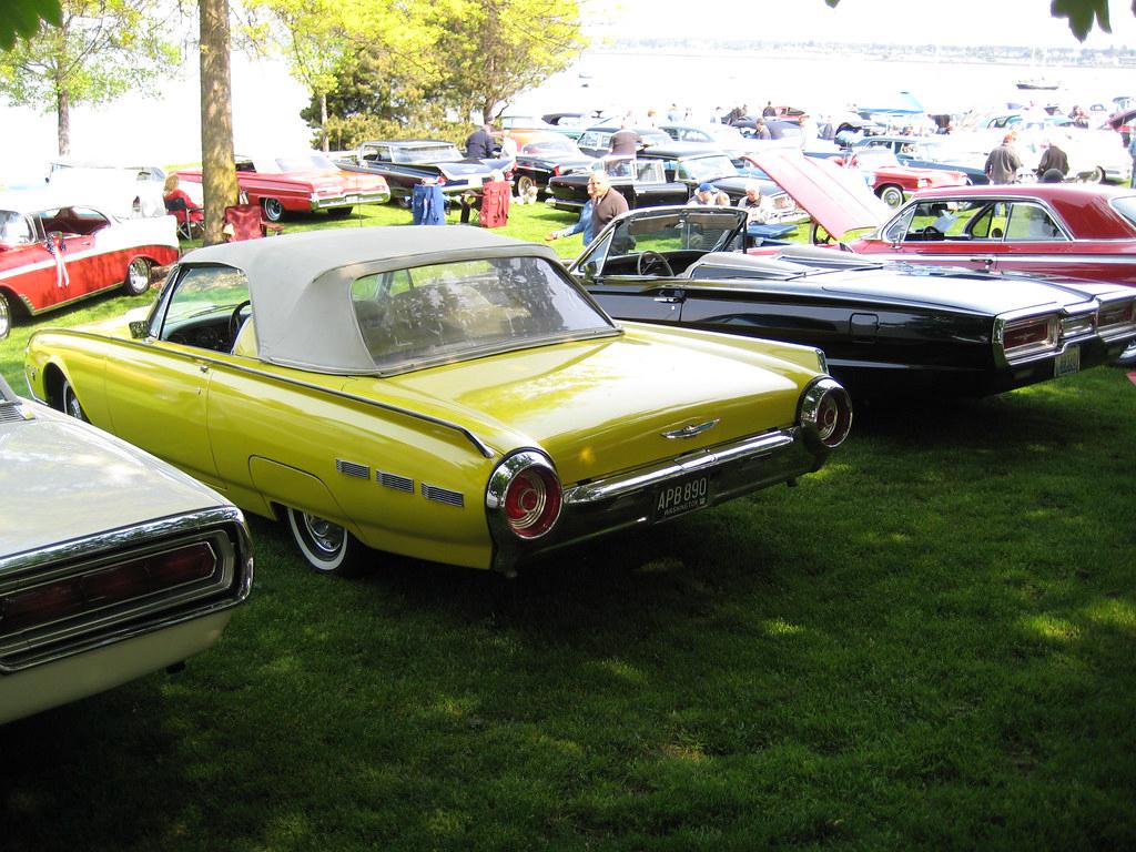A lineup of various Ford Thunderbird models representing different eras and variants